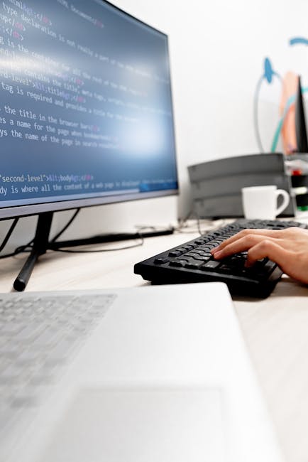 A close-up view of a computer screen displaying lines of code with syntax highlighting in various colors such as green, blue, purple, and red. The code appears to be part of a web application's backen